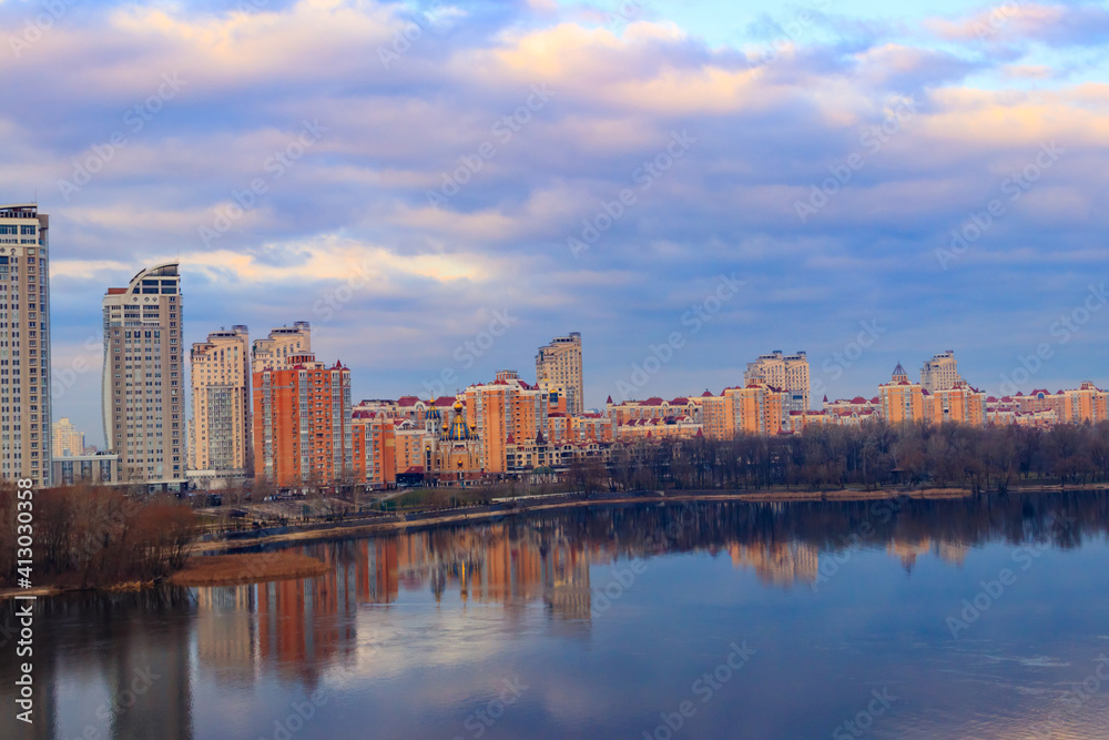 Obraz premium View of Obolon embankment of the Dnieper river and church of the Nativity of Christ in Kiev, Ukraine