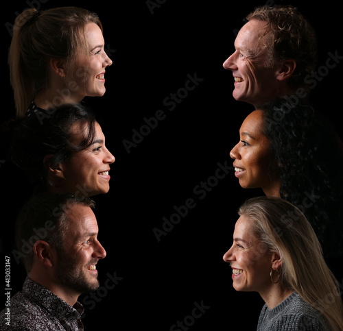 Group of beautiful people in front of a black background
