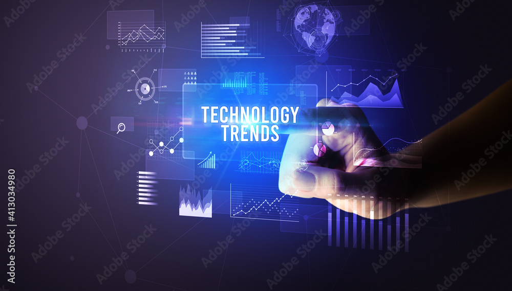 Hand touching TECHNOLOGY TRENDS inscription, new business technology concept Hand touching TECHNOLOGY TRENDS inscription, new business technology concept