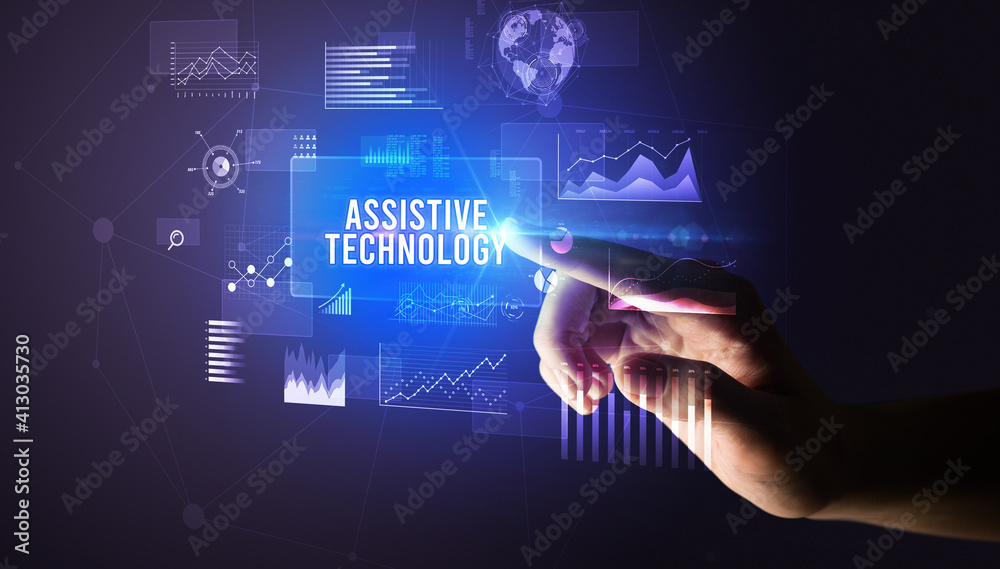 Hand touching ASSISTIVE TECHNOLOGY inscription, new business technology concept Hand touching ASSISTIVE TECHNOLOGY inscription, new business technology concept