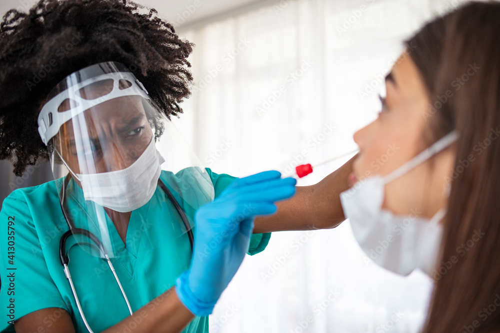 Doctor in Taking a Nasal Swab From a Person to Test for Possible Coronavirus Infection. Experienced lab technician collecting the sample of mucus from the female patient nose for analysis Doctor in Taking a Nasal Swab From a Person to Test for Possible Coronavirus Infection. Experienced lab technician collecting the sample of mucus from the female patient nose for analysis