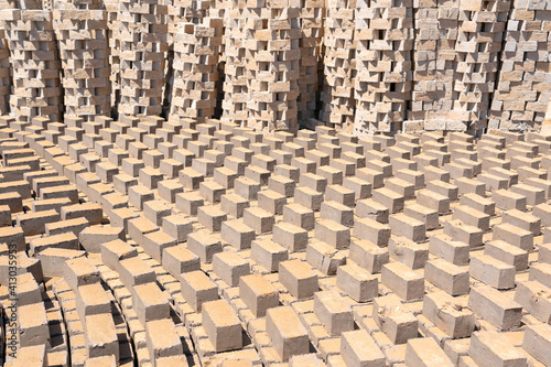 Africa, Madagascar, Antananarivo. Bricks are set out to dry in an interesting pattern.