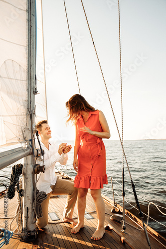 The moment of a marriage proposal on a yacht. Will you marry me.
