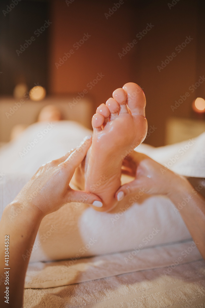 Φωτογραφία Female getting a professional foot massage in a beauty spa salon - beauty treatm