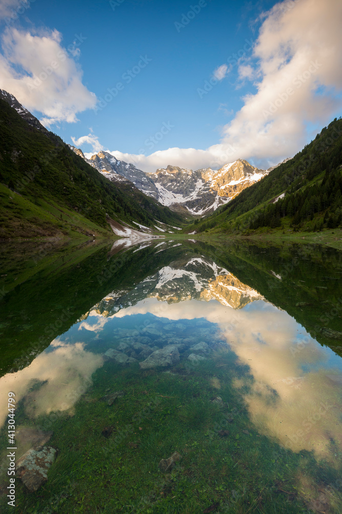 Orobie Alps mirrored in the waters of Lake Zappello, Valtellina, Lombardia, Italy