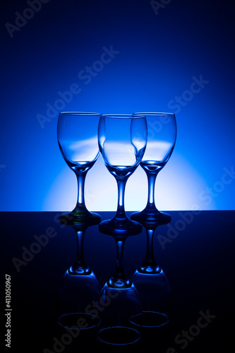 Empty wine glasses with blue background