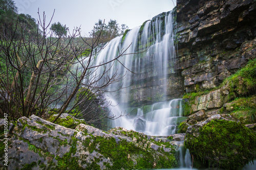 Beautiful waterfall in the mountains of Serra de Aire, Portugal. Long exposure of the waterfall of Fornea in Porto de Mos, Portugal.  photo