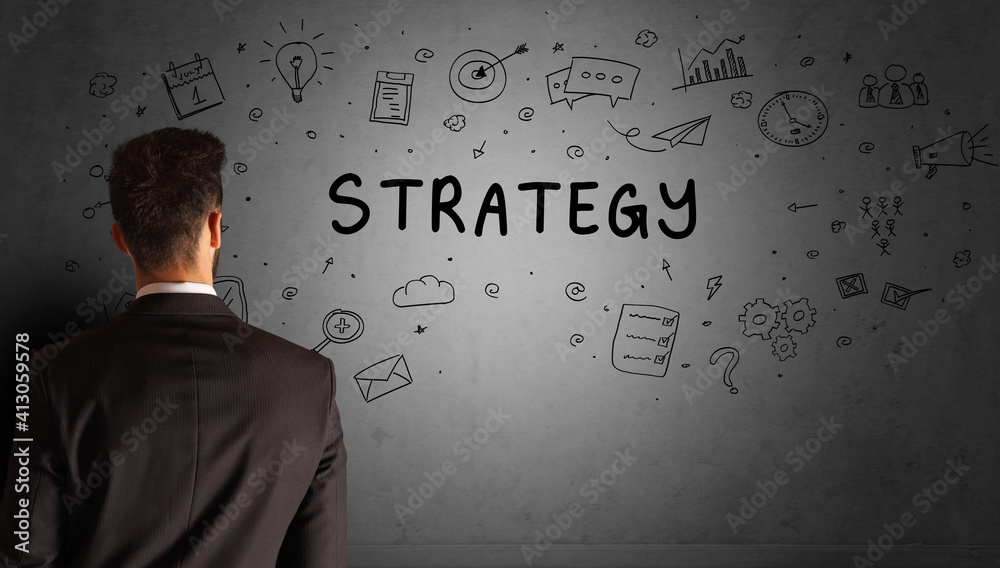businessman drawing a creative idea sketch with STRATEGY inscription, business strategy concept businessman drawing a creative idea sketch with STRATEGY inscription, business strategy concept