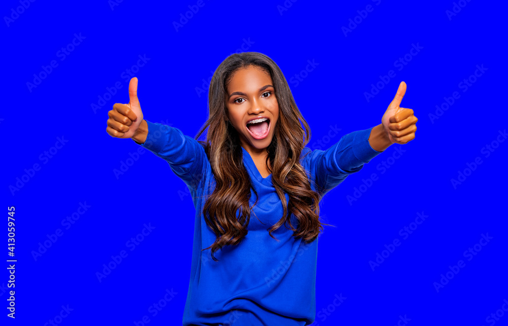 Portrait of an excited black woman showing ok sign, two thumbs up cool, isolated over color background. Portrait of an excited black woman showing ok sign, two thumbs up cool, isolated over color background.