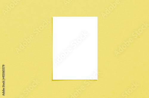 Blank white vertical paper sheet 5x7 inches with shadow overlay. Modern and stylish greeting card or wedding invitation mock up.