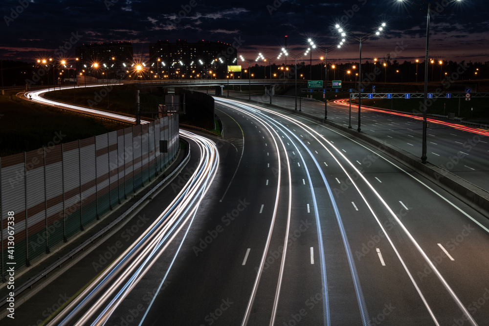 Scenic light trails of fast traffic on a highway Scenic light trails of fast traffic on a highway