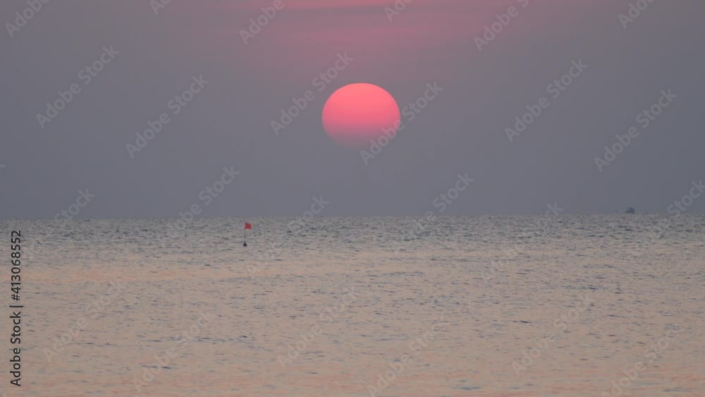 Real time shot in the serene ocean with soft waves and majestic sunset. Real time shot in the serene ocean with soft waves and majestic sunset.