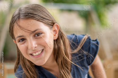 Close-up of young girl looking at the camera smiling