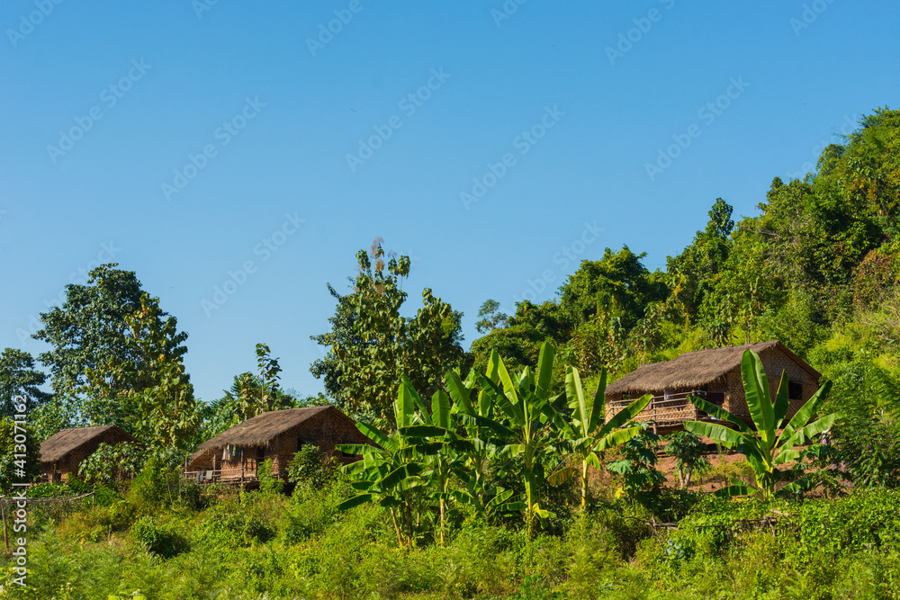 Myanmar. Shan State. Near Kalaw. Green Hill Valley Elephant Camp. Traditional Burmese house nestled against the forest. Myanmar. Shan State. Near Kalaw. Green Hill Valley Elephant Camp. Traditional Burmese house nestled against the forest.