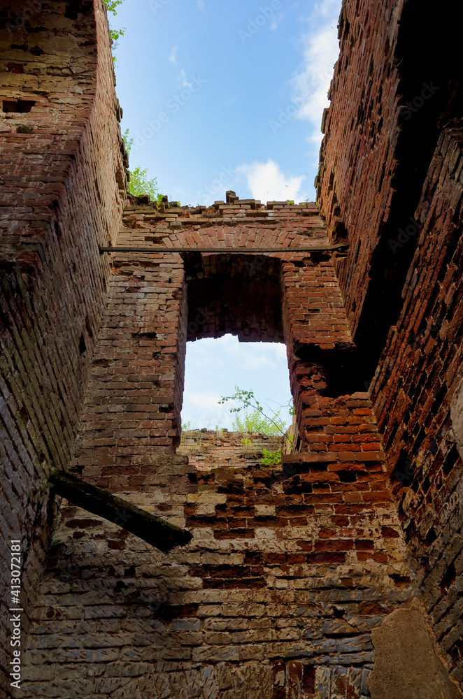 Strict brick walls of the building. Vintage red brick of ruined building