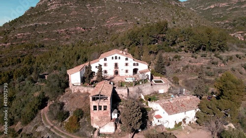 Aerial views of a farmhouse in Catalonia surrounded by vineyards