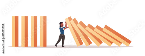 african american businesswoman stopping domino effect crisis management chain reaction finance intervention conflict prevention concept horizontal full length vector illustration
