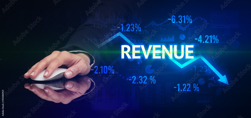 male hand holding wireless peripheral with REVENUE inscription, modern business concept male hand holding wireless peripheral with REVENUE inscription, modern business concept