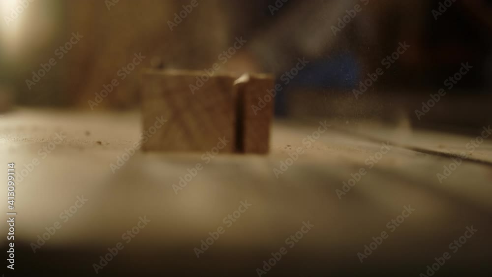 Unrecognized guy preparing plank indoors. Wooden plank cutting on saw machine Unrecognized guy preparing plank indoors. Wooden plank cutting on saw machine