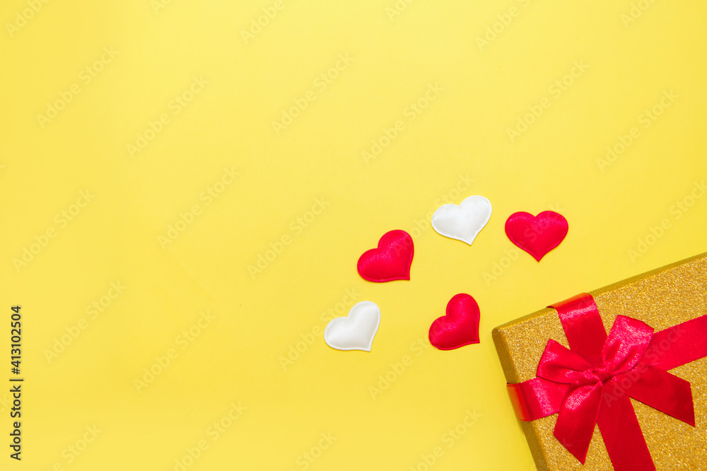 Happy Valentine's Day flatlay. Top view present gift box, hearts on on yellow color of the year 2021 background. Valentine day or New Year greeting card. panton
