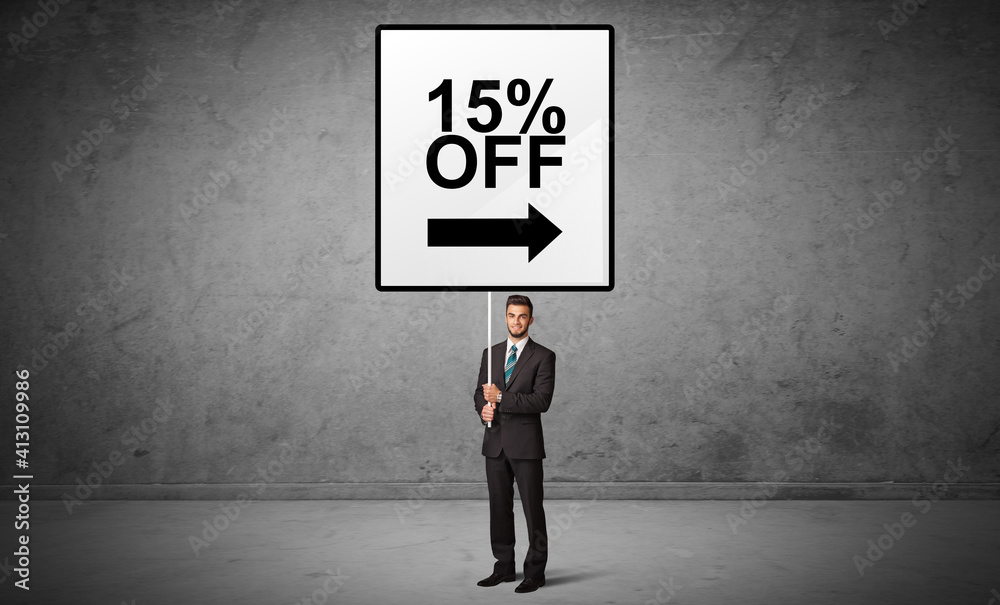 business person holding a traffic sign with 15% OFF inscription, new idea concept business person holding a traffic sign with 15% OFF inscription, new idea concept