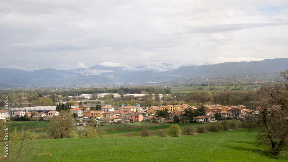 Fototapeta premium Village in a picturesque valley at the foot of the mountains