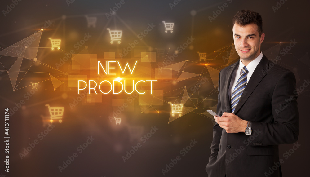 Businessman with shopping cart icons and NEW PRODUCT inscription, online shopping concept Businessman with shopping cart icons and NEW PRODUCT inscription, online shopping concept