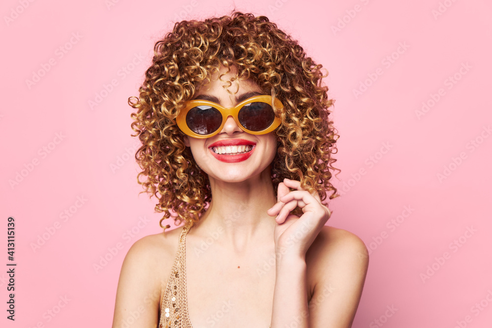 Fototapeta premium Woman portrait Smile trendy glasses curly hair Studio charm 