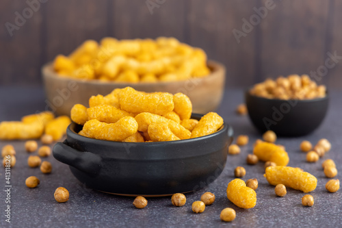 Organic plant based non gmo gluten free chickpea puff snacks in a bowl on a dark background