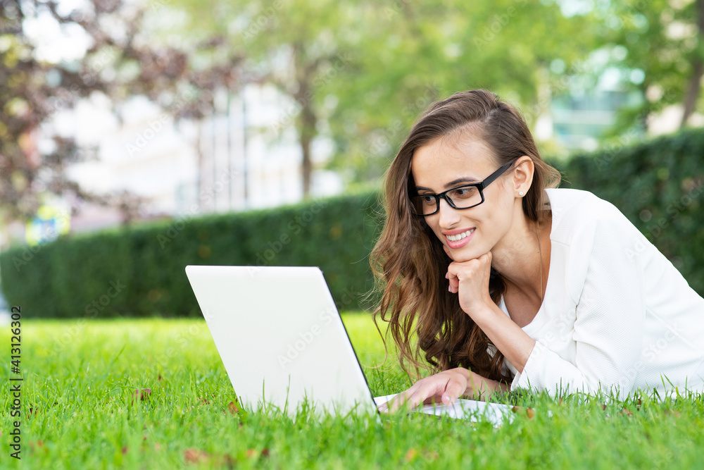 young woman and laptop in the park young woman and laptop in the park
