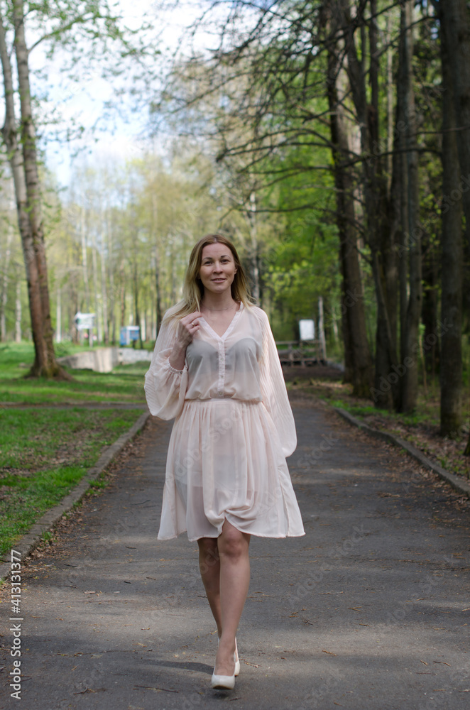 young girl in a dress in the park