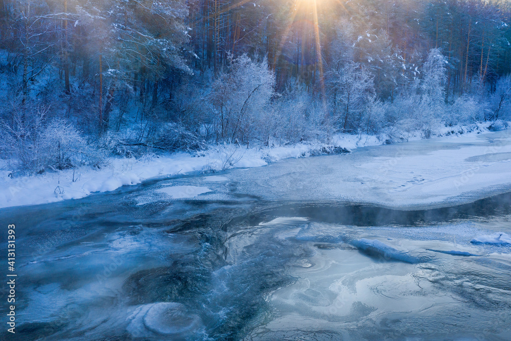 Winter landscape. Mountain river and forest covered with ice, frost and snow. Altai Republic, Siberia, Russia. Winter landscape. Mountain river and forest covered with ice, frost and snow. Altai Republic, Siberia, Russia.