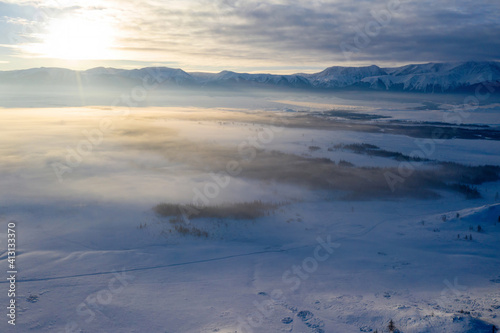 Aerial view of Kuray steppe on winter misty morning. Altai Republic, Siberia, Russia. © Kirill