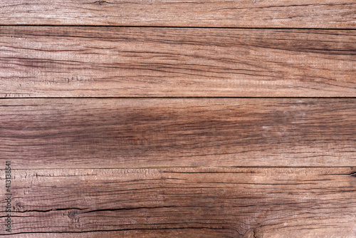 Natural wood grain texture, brown, cracked and old.