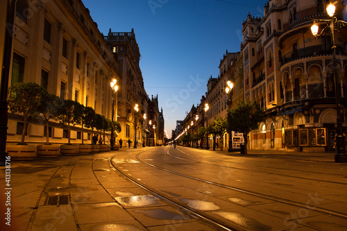 the morning lights announce the sunrise in the city center of Seville,spain