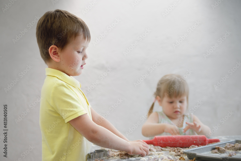 children prepare chocolate cookies in the ida of the traditional Easter rabbit children prepare chocolate cookies in the ida of the traditional Easter rabbit