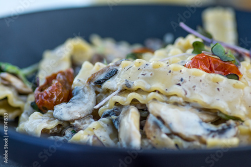 Mafaldine pasta with cherry tomatoes photo