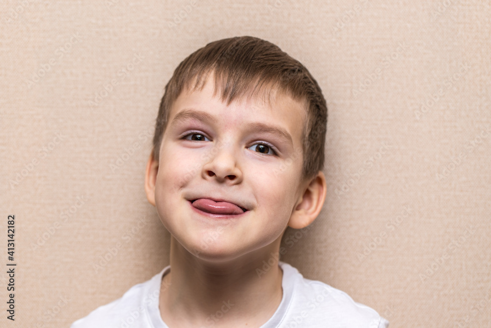 Fototapeta premium close-up portrait of a boy of six years old. Shows language