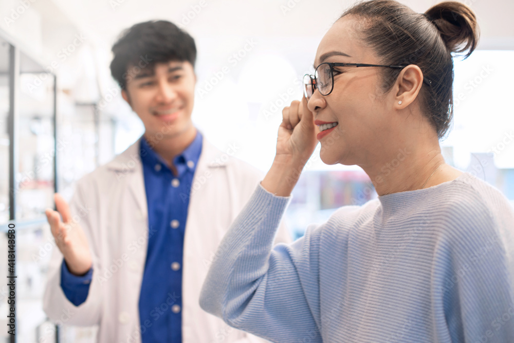 Optometrists are recommending glasses frames for middle age. and customer is trying a new frame, eyesight and vision concept,  selective focus