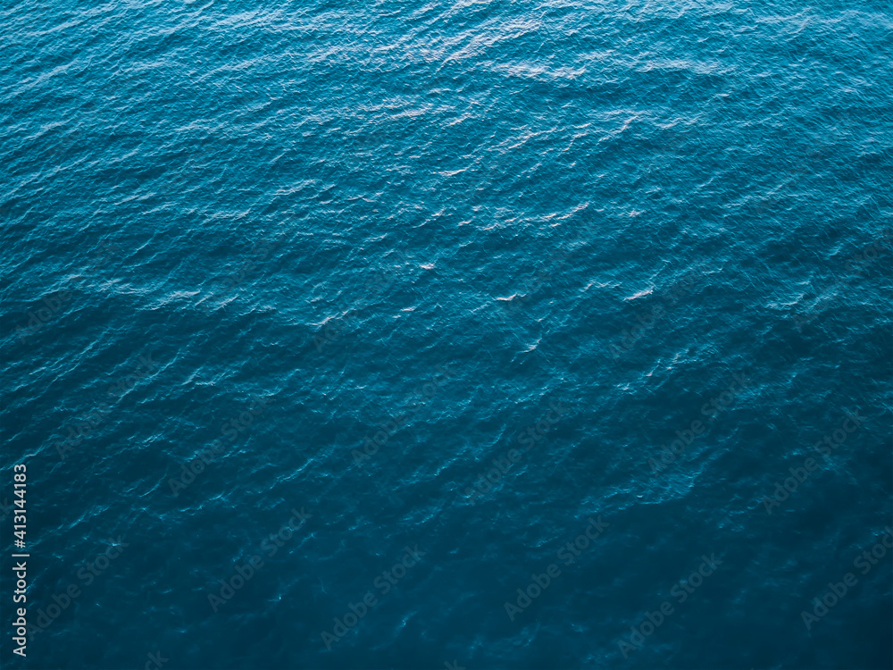 Top view of deep cold sea, texture of small waves. Dark sea background. Texture of water in the ocean.