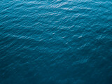 Top view of deep cold sea, texture of small waves. Dark sea background. Texture of water in the ocean.