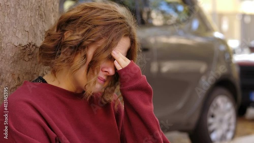 sadness, unhappiness - young woman cries thinking about her ex boyfriend photo