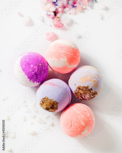 multicolored bath bombs on a light background