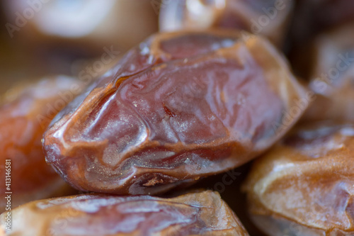 Close up view of dried Medjool dates (fruits of the date palm) piled up  photo