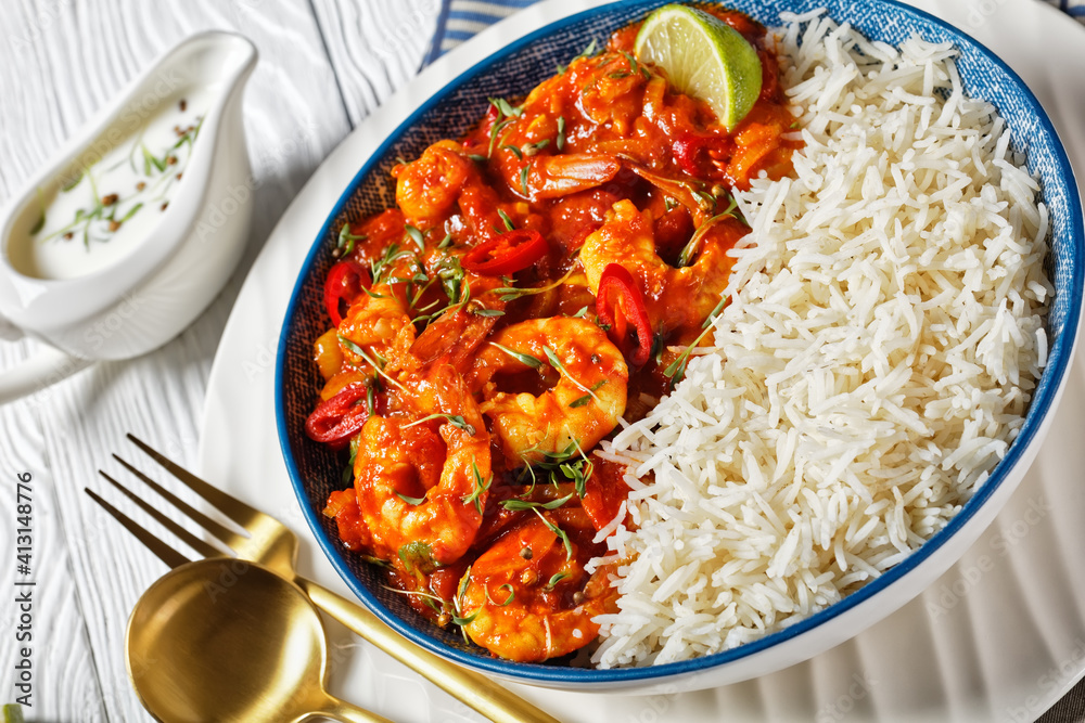 Tomato prawn curry with rice and yogurt, top view Tomato prawn curry with rice and yogurt, top view