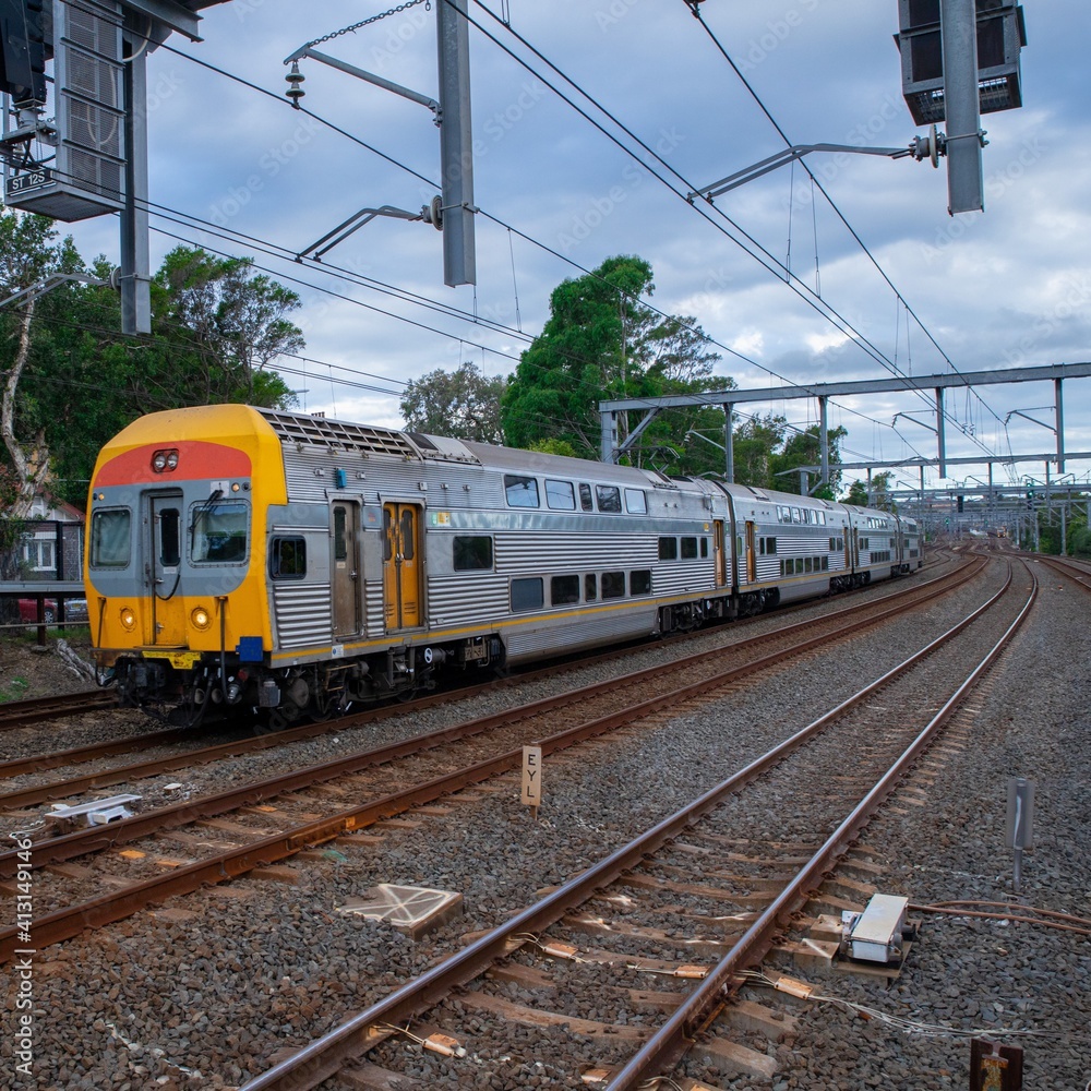 Commuter Train fast moving through a Station in Sydney NSW Australia Commuter Train fast moving through a Station in Sydney NSW Australia