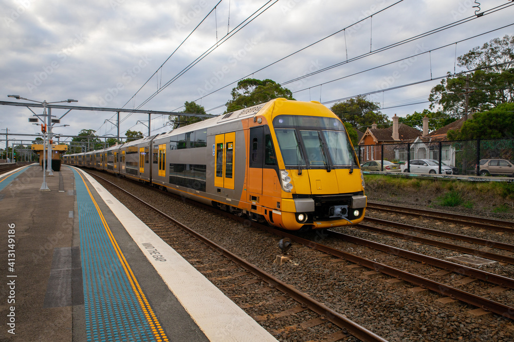 Commuter Train fast moving through a Station in Sydney NSW Australia Commuter Train fast moving through a Station in Sydney NSW Australia