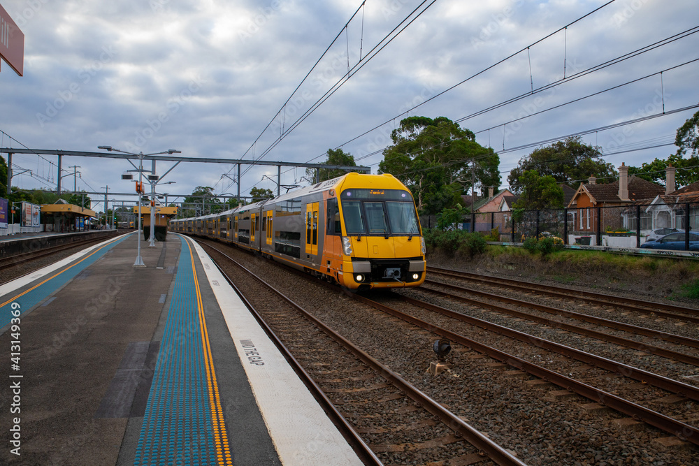 Commuter Train fast moving through a Station in Sydney NSW Australia Commuter Train fast moving through a Station in Sydney NSW Australia