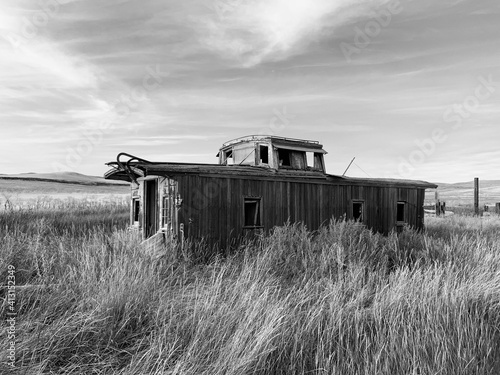 Photos abandoned caboose in tall grass b&w