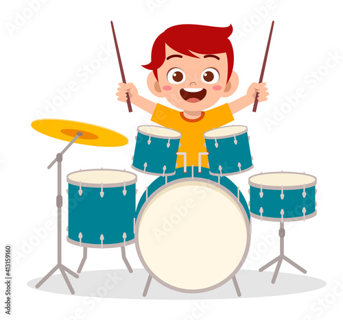 cute little boy play drum in concert